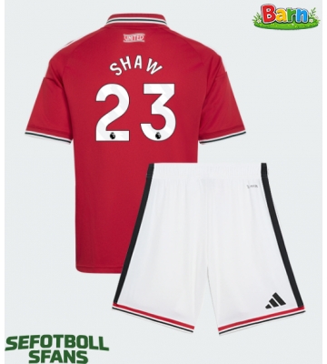 Manchester United Luke Shaw #23 Hemmaställ Barn 2026-27 Kortärmad (+ Korta byxor)